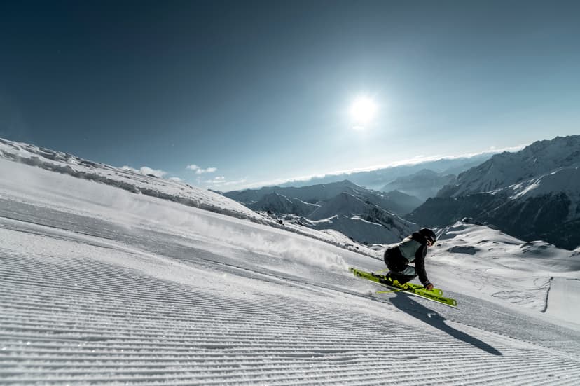 Person skiing down mountain piste in Austria